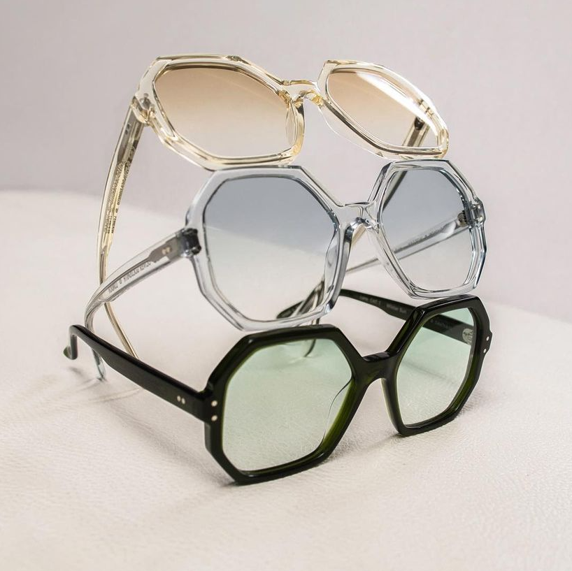 Three Olivier Goldsmith octagonal-shaped sunglasses in clear and black stacked on each other