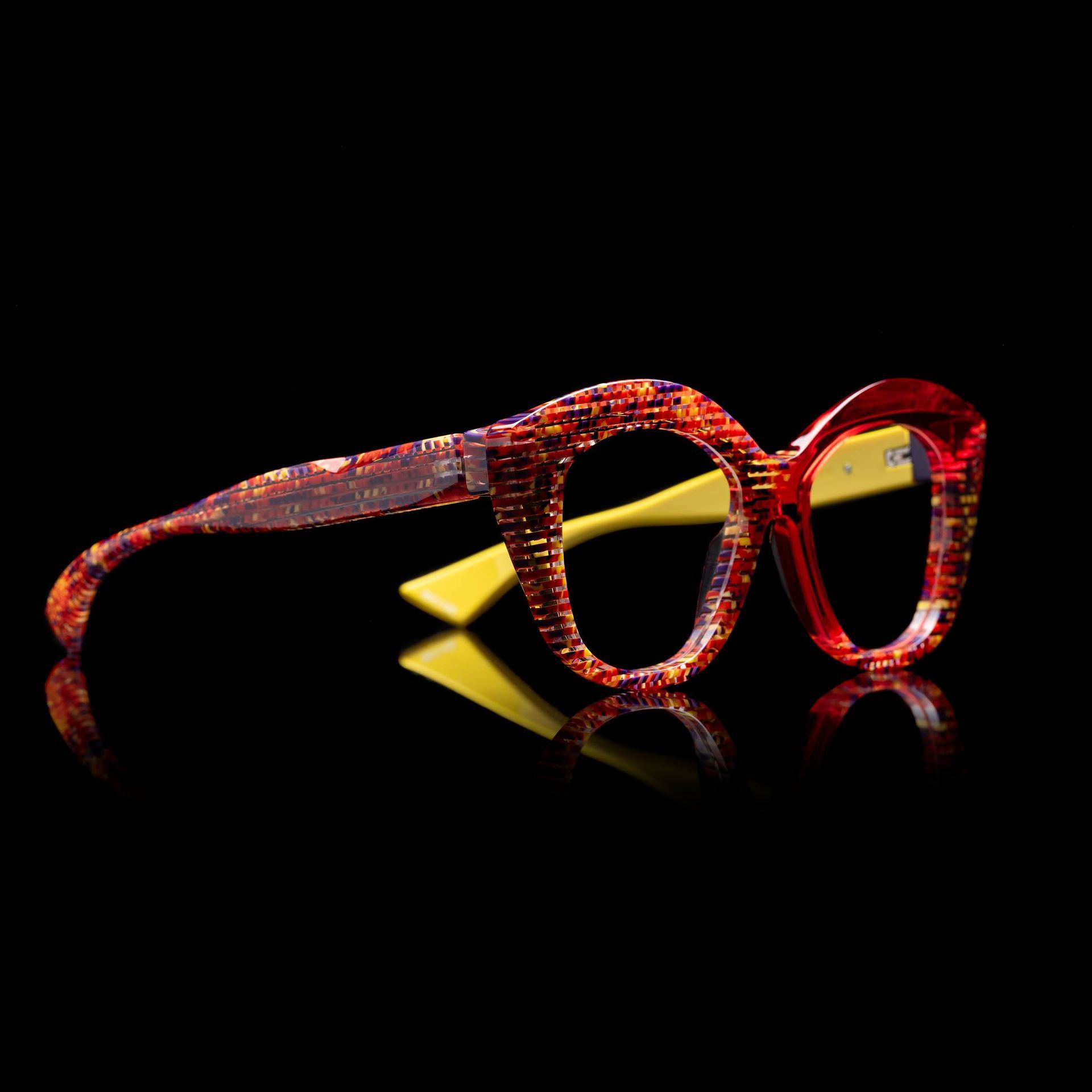 A pair of Pieroo Massara glasses in red and yellow