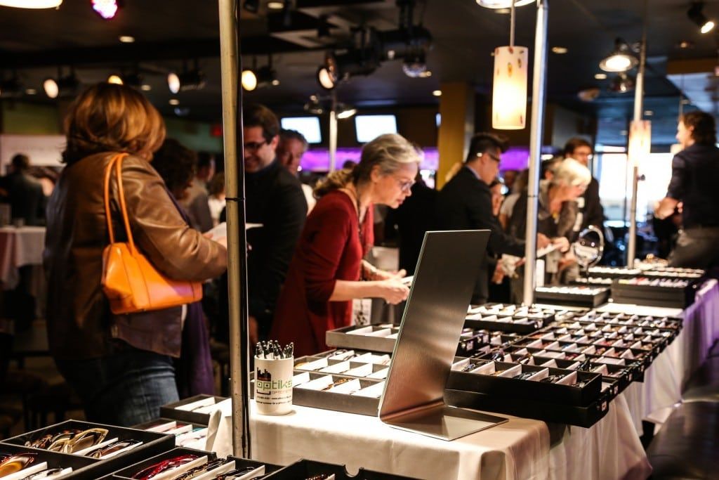People looking at frame lines at 2015 Raise Your Glasses event