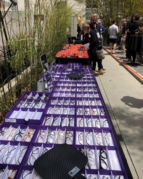 Eyeglass and sunglass frames in display boxes at Raise Your Glasses 2019 Event