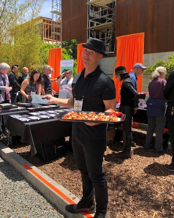 Server holding appetizer tray at Raise Your Glasses 2019 Event