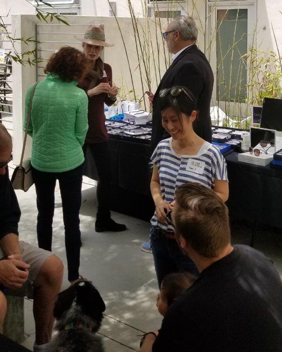 Shoppers standing outside chatting at  Raise Your Glasses 2019 Event