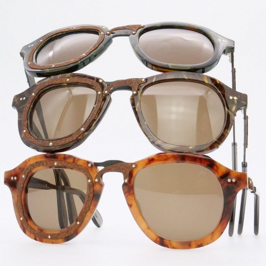 Three pairs of Say-oH sunglasses with rusted metal details stacked on top of each other