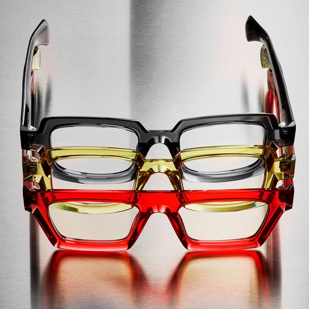 Stack of three Theo frames in translucent gray, yellow and red