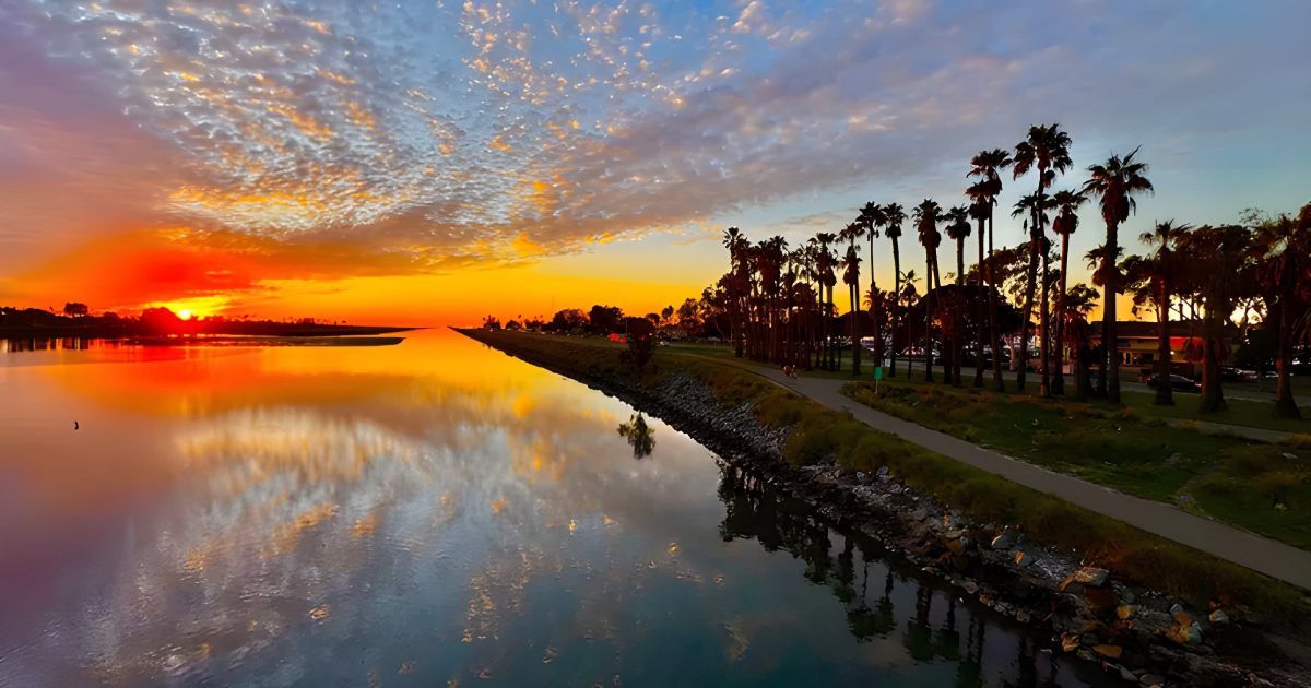 San Diego sunset over a calm waterway, reflecting the colorful sky. 