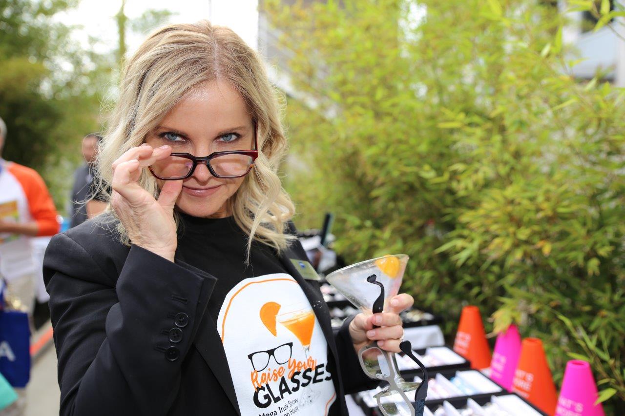 Smiling person wearing event t shirt at Raise Your Glasses 2017 Event