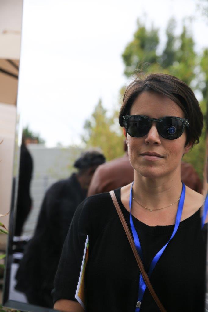 Woman posing in sunglasses at Raise Your Glasses 2017 Event