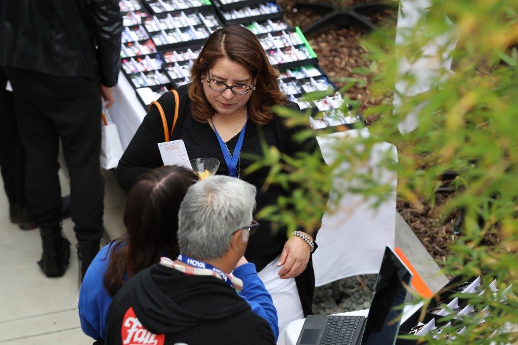 Woman holding martini glass at Raise Your Glasses 2017 Event