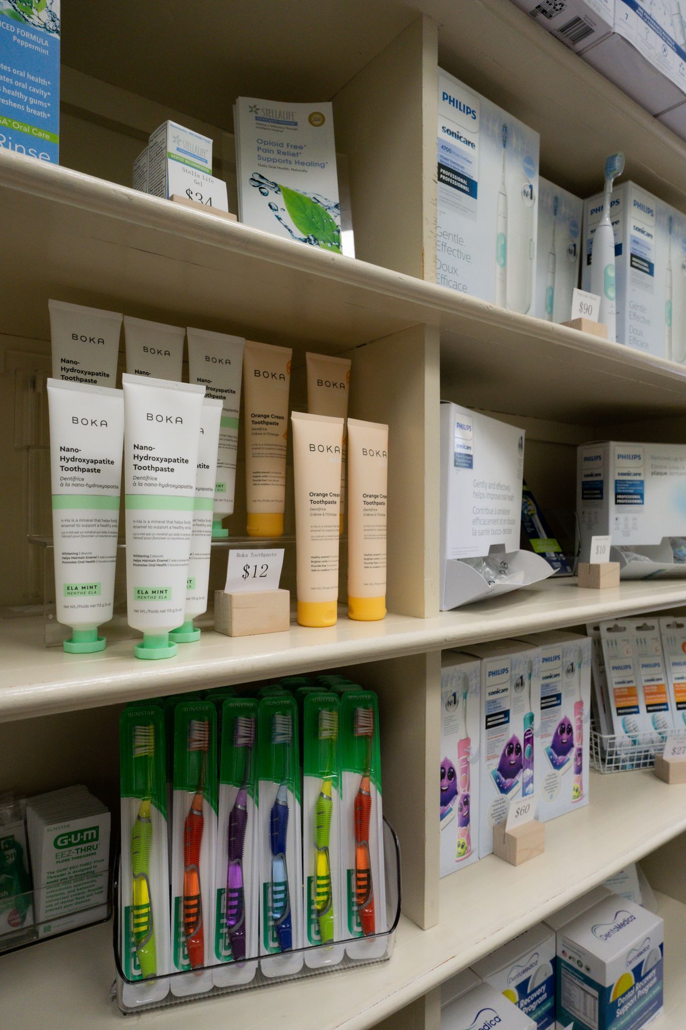 A store shelf filled with toothpaste and toothbrushes