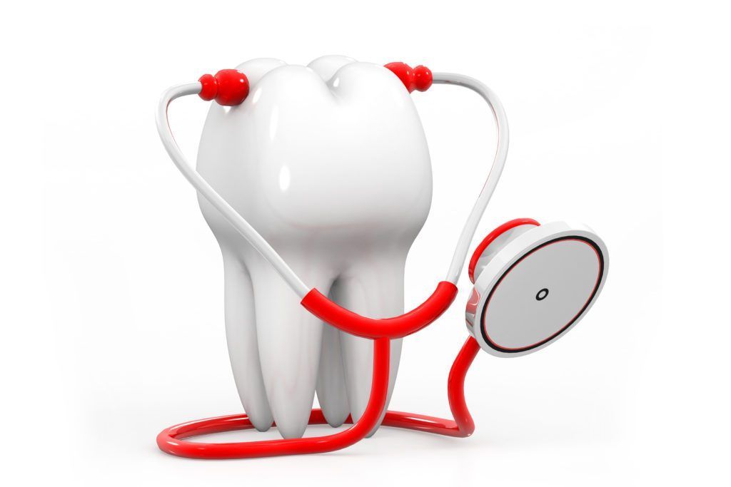 A tooth is being examined by a stethoscope.
