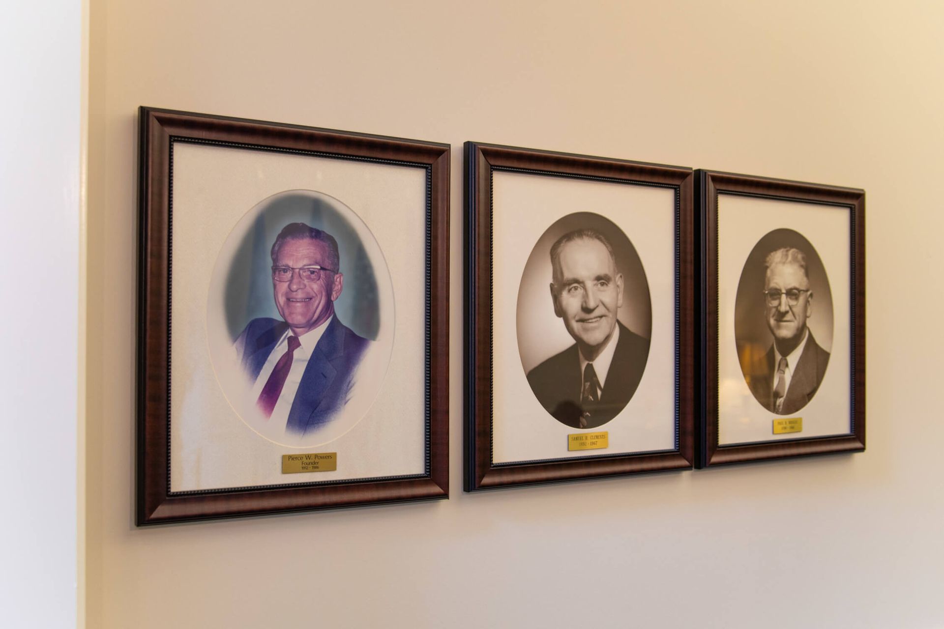 A large brick building with a sign in front of it.
