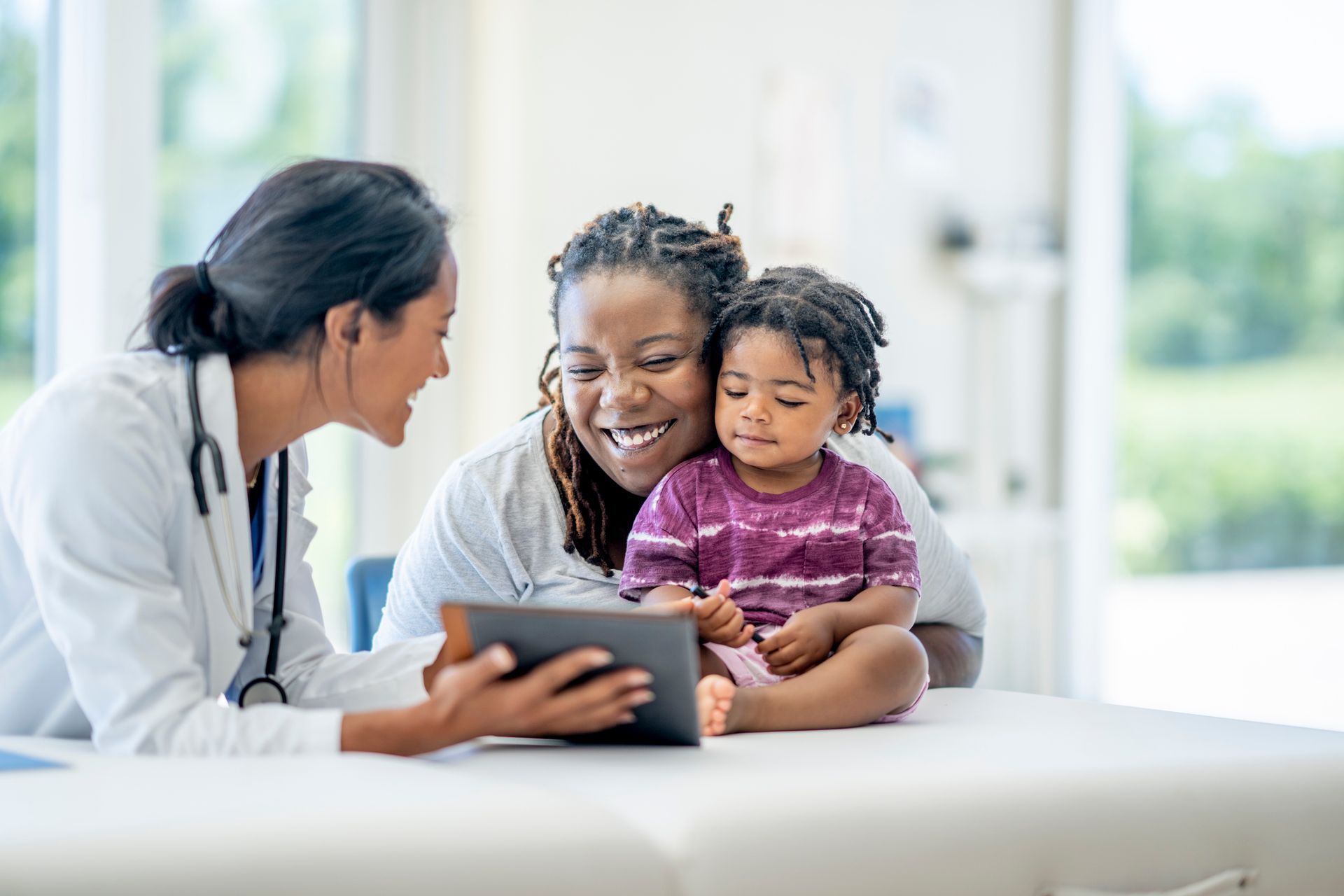 Mother and Child with Doctor — Harrisonville, MO — Fast Comprehensive Care