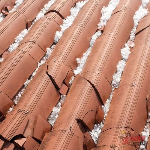 A close up of a roof with a lot of hail on it