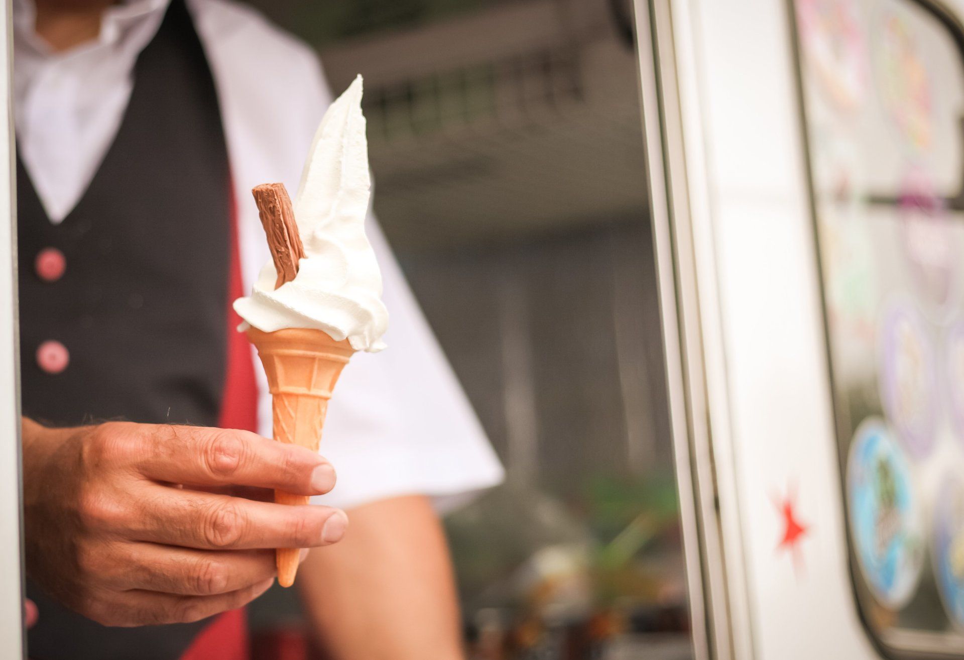 a man holding an ice cream