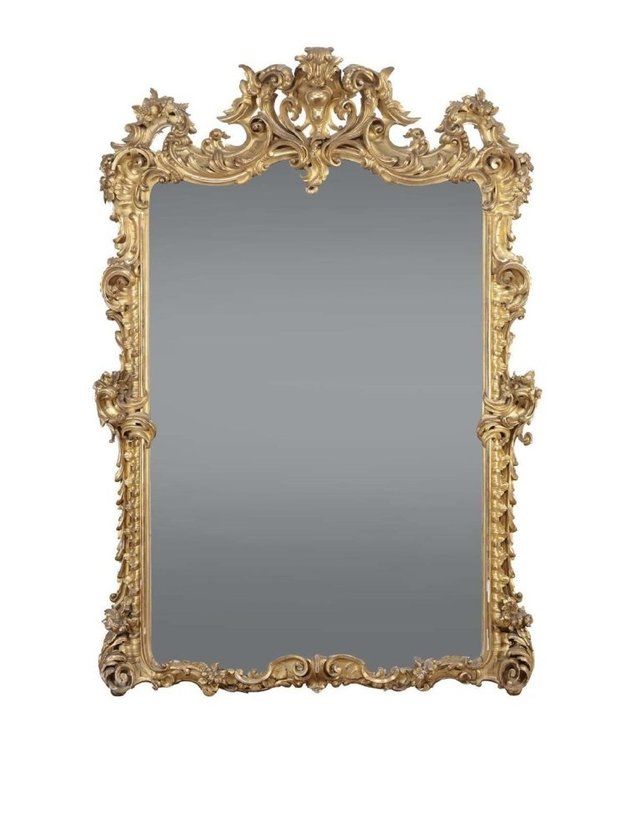 Grande specchiera in legno riccamente intagliata e dorata, Napoli metà XIX secolo