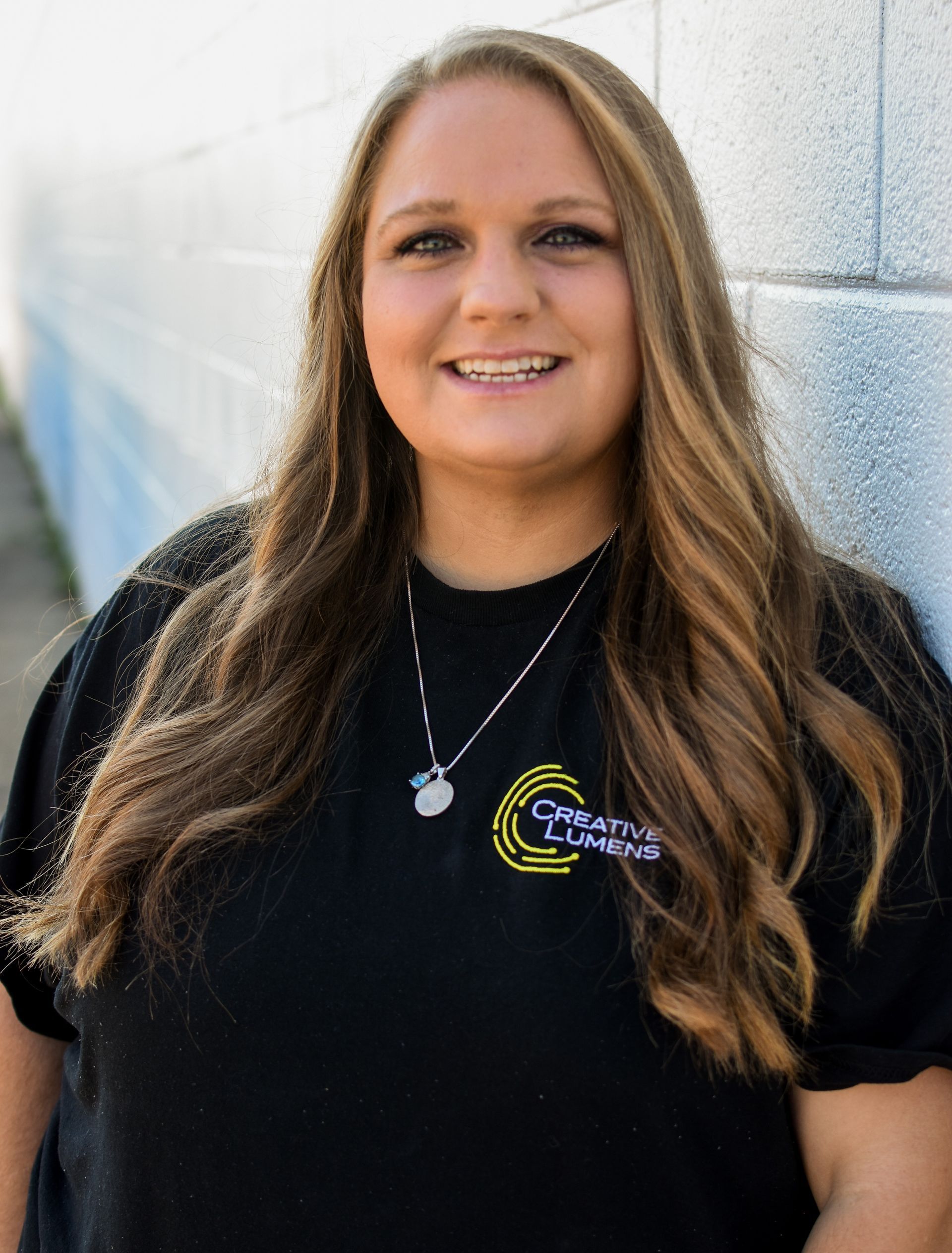 A silhouette of a person without a face on a gray background.