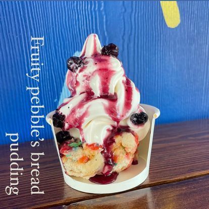 A cup of fruity pebbles bread pudding on a table