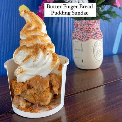 A cup of butter finger bread pudding sundae on a table