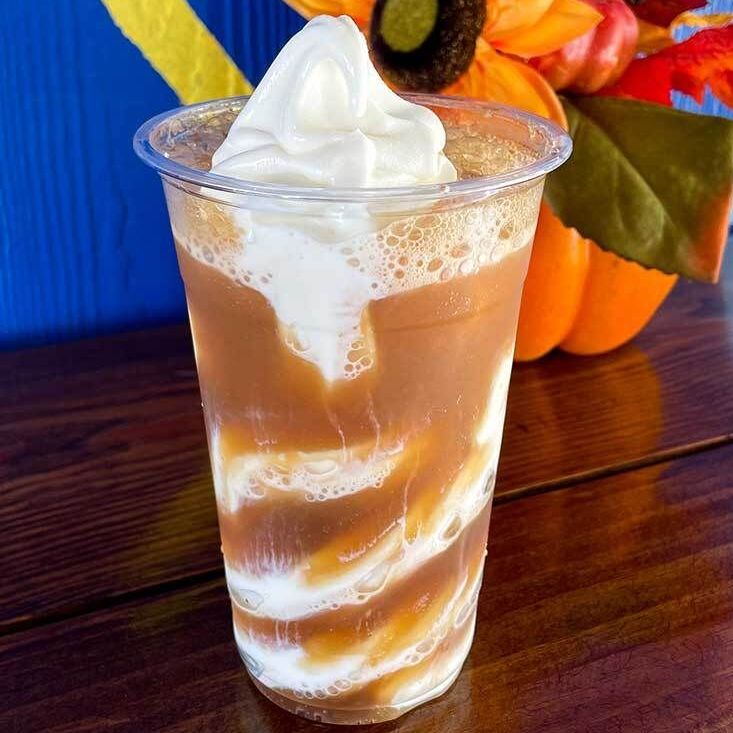 soda float with aa cup of ice cream with whipped cream on top