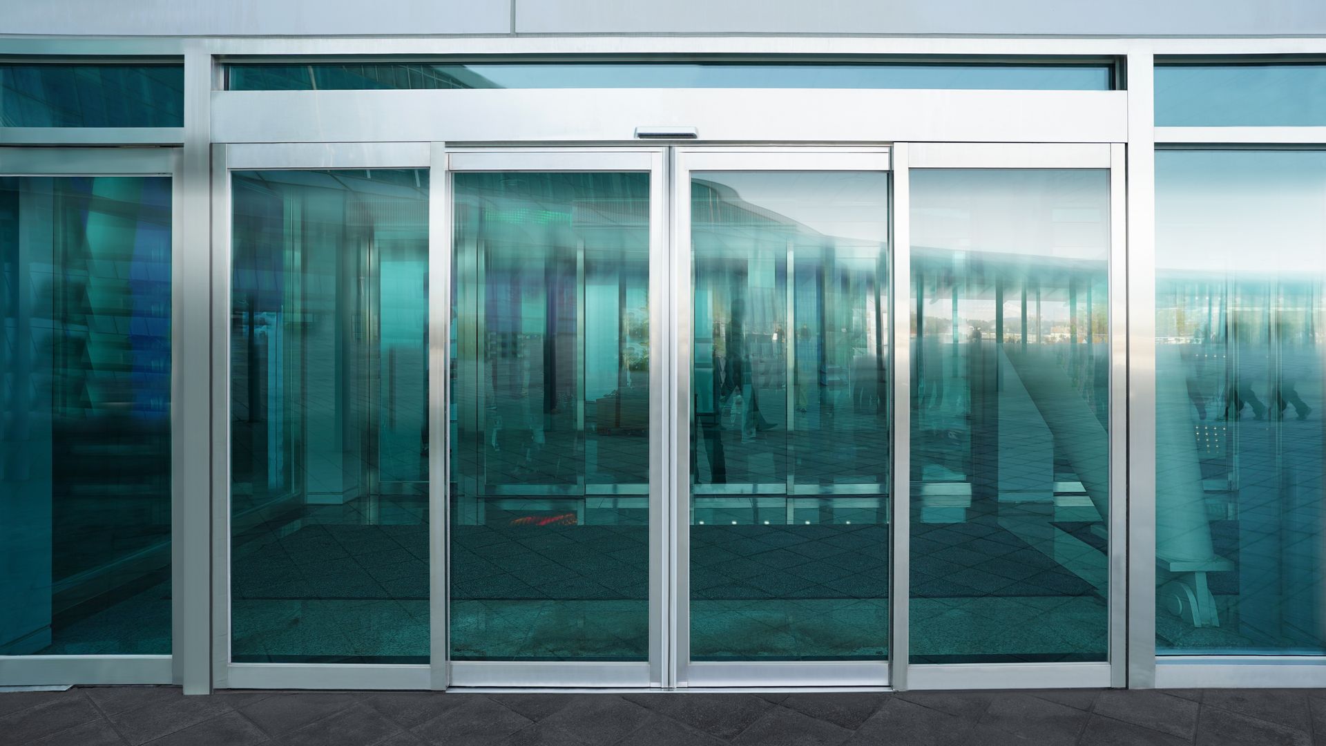 Modern office sliding door highlighting professional commercial glass repair services.