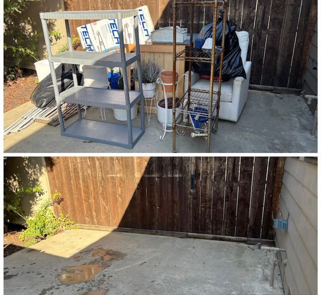 Cardboard debris and a wooden cabinet, then a cleaned concrete path.