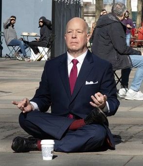 An aerial view of a boat floating on top of a large body of water.