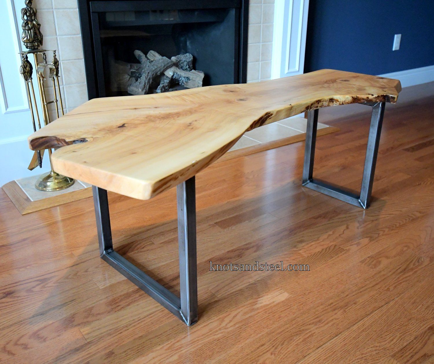 Live edge Maple coffee table with a metal base and legs