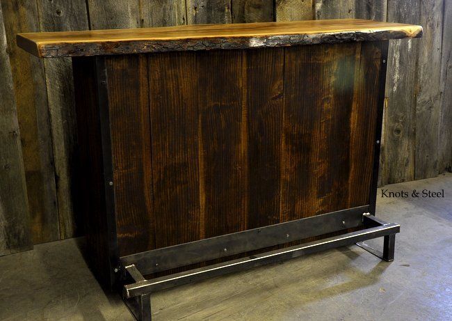 Rustic black cherry bar made with industrial steel and a live edge natural wood slab