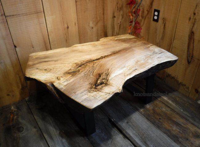 Live edge sugar maple coffee table with a industrial steel frame and legs.
