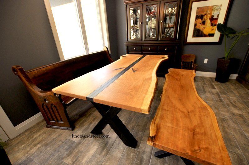 Dining room table made with live edge black cherry wood from local Ontario wood. This table also has a unique industrial steel design.