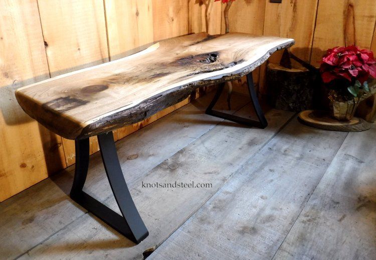 Live edge small coffee table with bent steel legs.