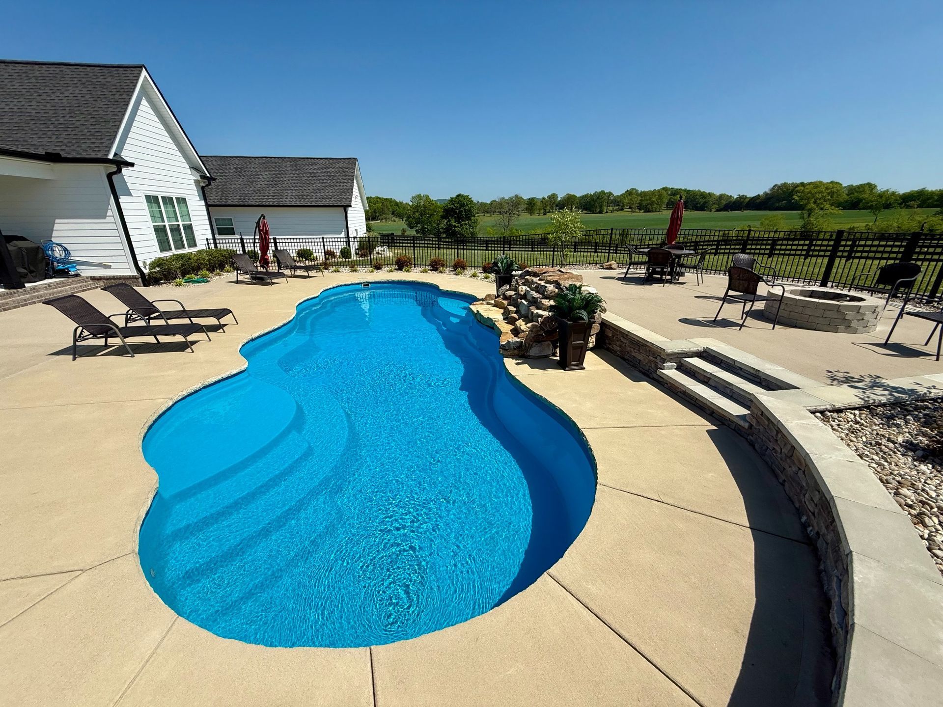 Entry steps of the 16x40 pool in Lascassas, showing clean design and landscaping