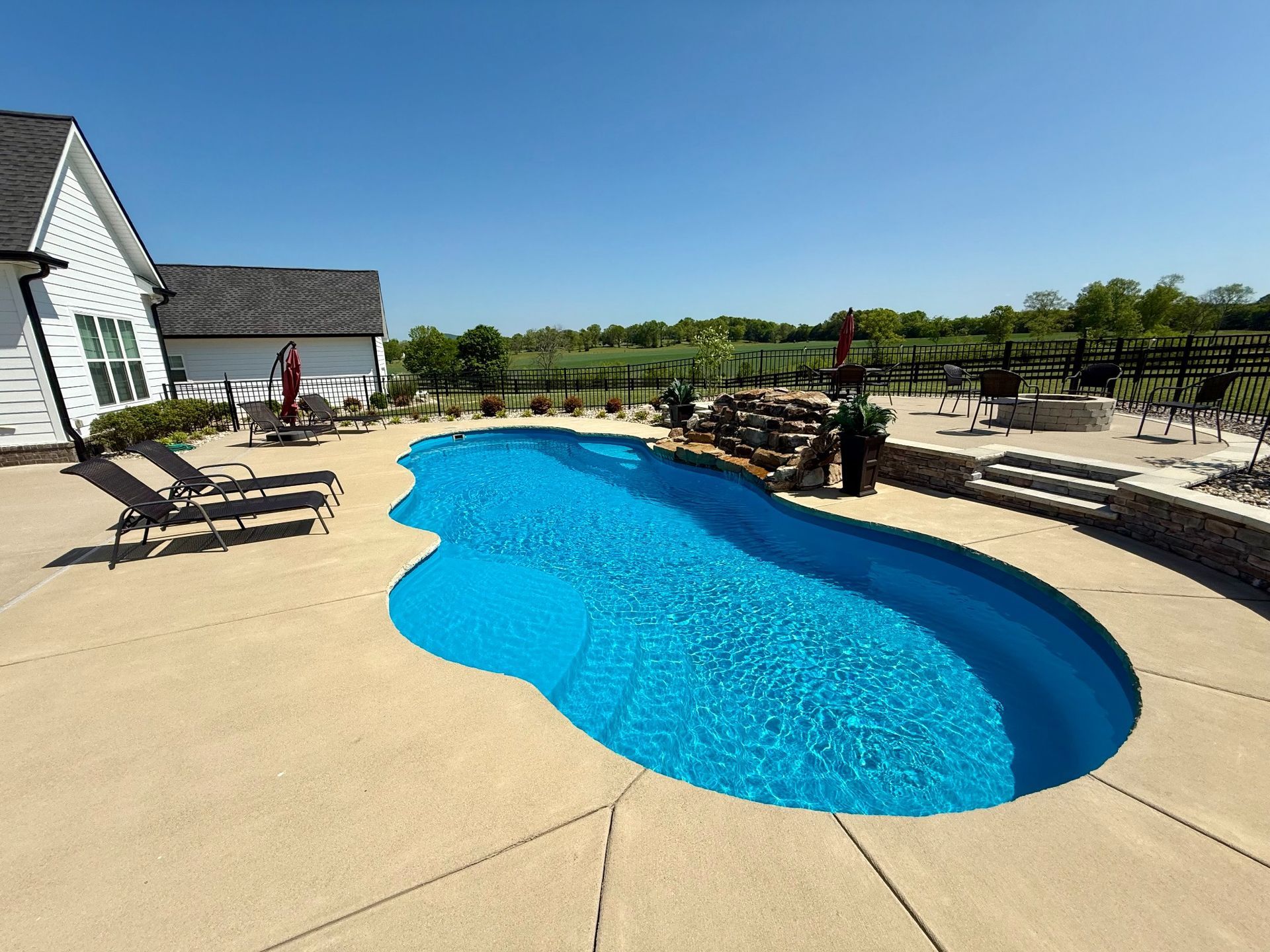 Close-up of pool water and natural rock water feature at Lascassas property