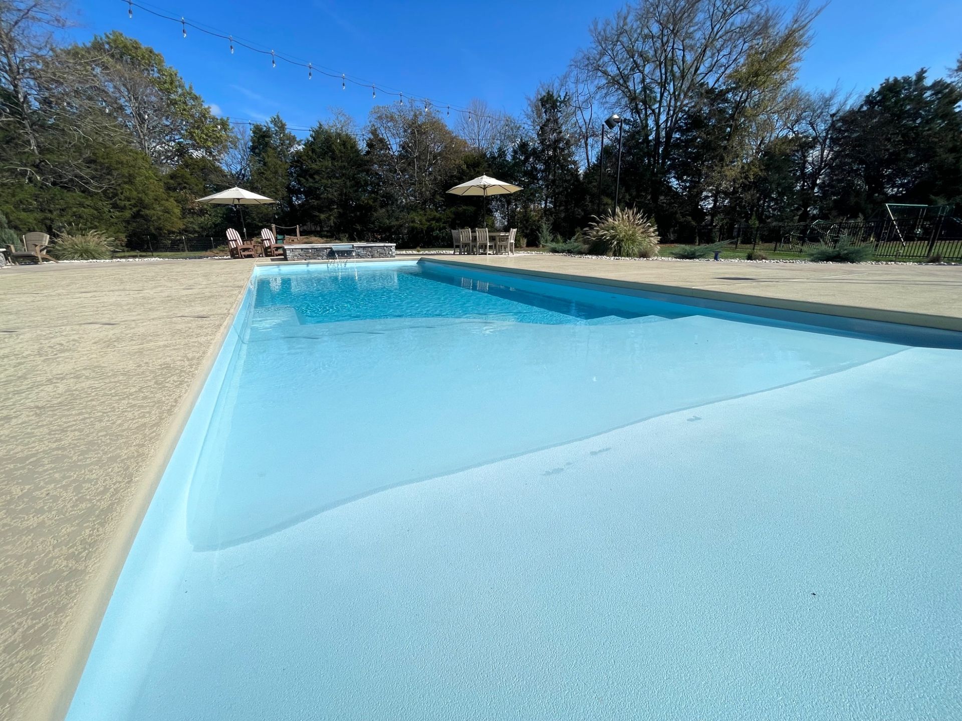 Close-up of spillover spa connected to Grace beach entry pool in Murfreesboro TN