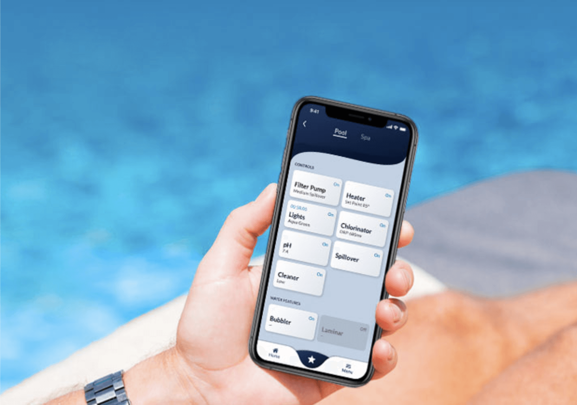 A person is holding a cell phone in front of a pool.