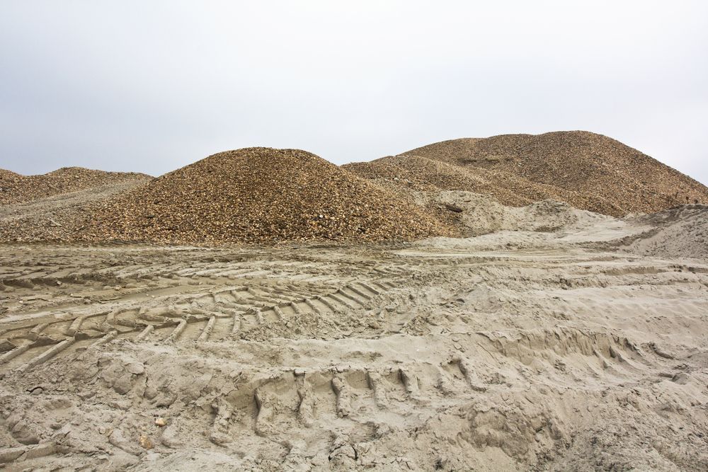 Large Piles of Harvested Sugar Beets on a Sandy, Muddy Field — Azza's Mini Diggers in Port Macquarie, NSW