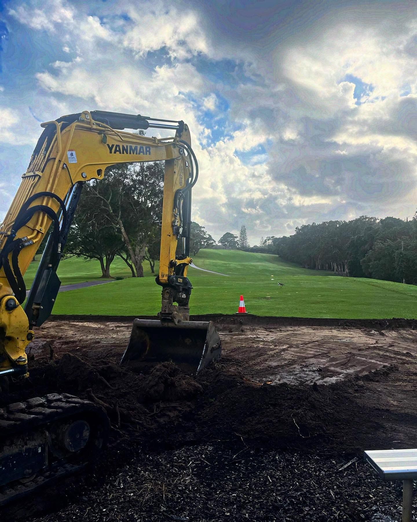 Yellow Excavator on a Golf Course, Digging in the Foreground — Azza's Mini Diggers in Port Macquarie, NSW