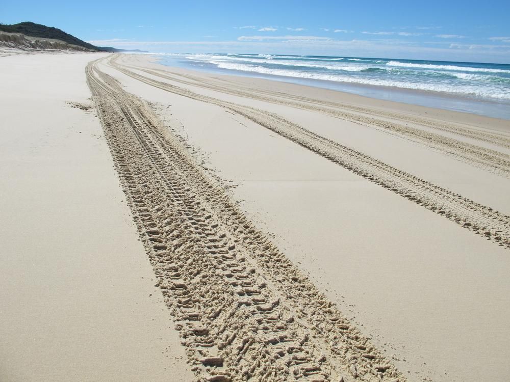 Tire Tracks in The Sand on A Beach Near the Ocean — Restore All Qld in Kingaroy, QLD