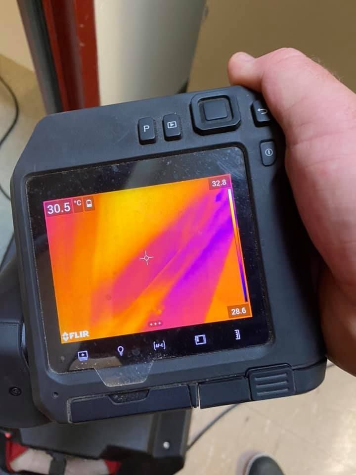 A Person is Holding a Thermal Camera — Restore All Qld in Toowoomba, QLD