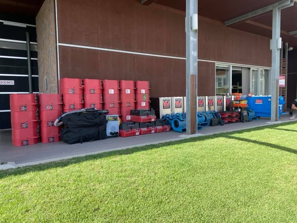 A Bunch of Boxes Are Sitting on the Side of a Building — Restore All Qld in Kingaroy, QLD
