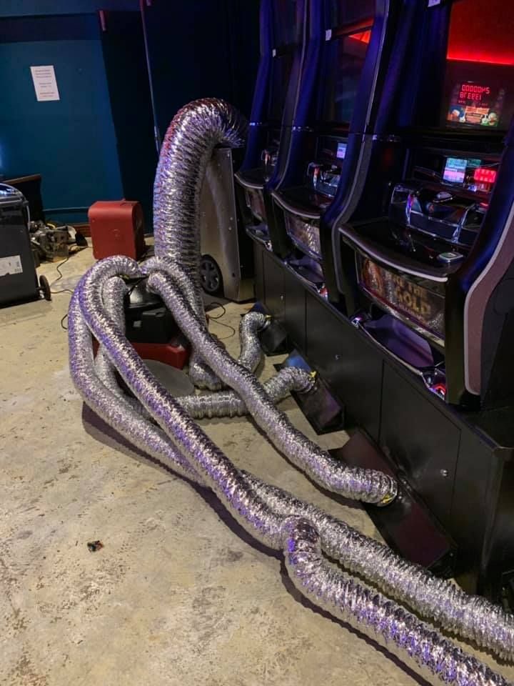 A Bunch of Hose Connected to a Machine in a Room — Restore All Qld in Kingaroy, QLD