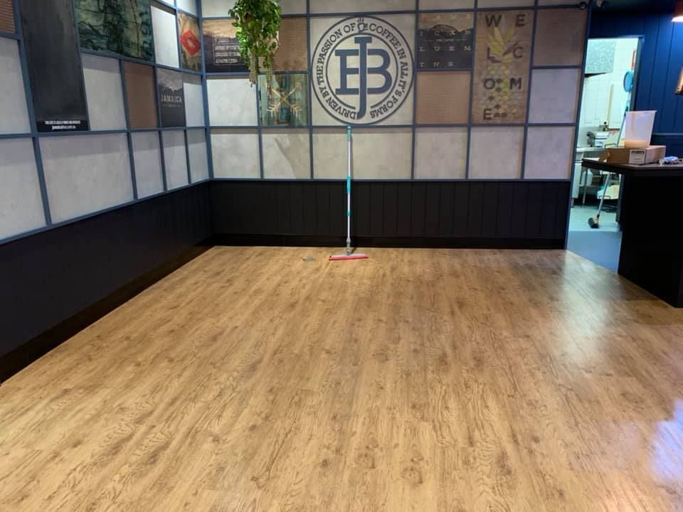 A Room With a Wooden Floor and a Mop in It — Restore All Qld in Sunshine Coast, QLD