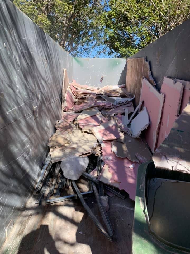 A Dumpster Filled With a Lot of Junk and a Tree — Restore All Qld in South Burnett, QLD