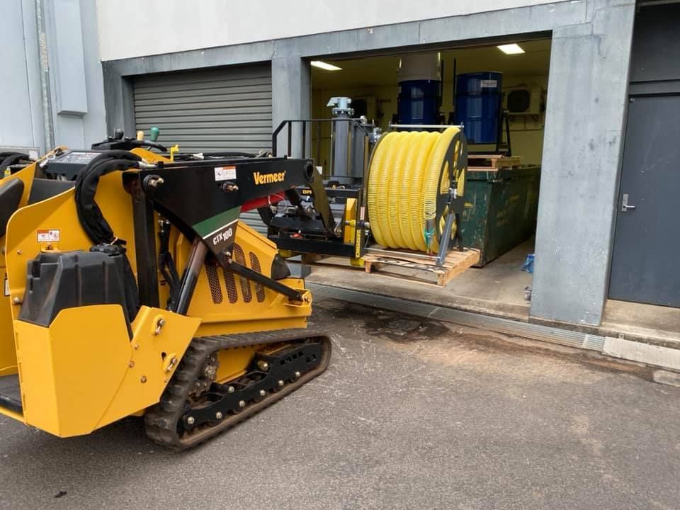 A Garage Door is Being Cleaned — Restore All Qld in Bundaberg, QLD