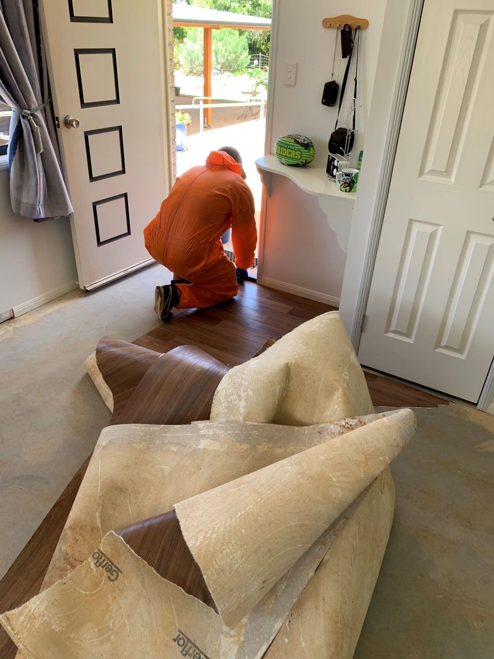 A Man in is Cleaning on the Floor in a Living Room — Restore All Qld in Western Downs, QLD
