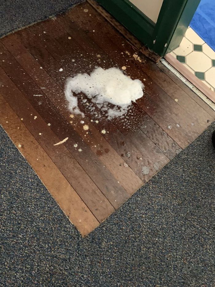 A Wooden Floor With a Substance on It — Restore All Qld in Toowoomba, QLD