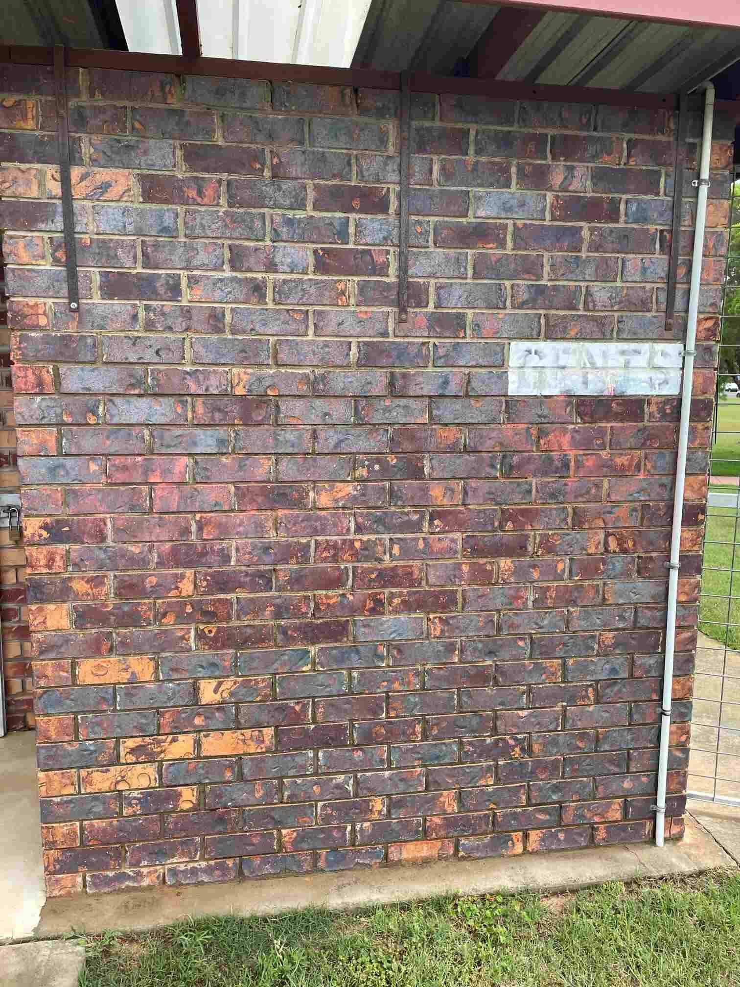 A Graffiti is Being Removed From the Brick Wall — Restore All Qld in Sunshine Coast, QLD