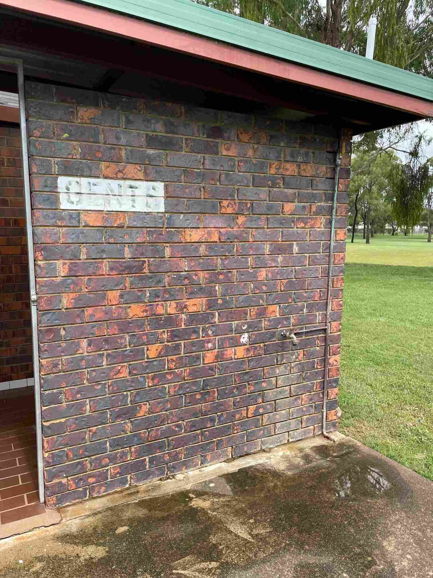 A Brick Building With a Sign on the Side — Restore All Qld in Kingaroy, QLD