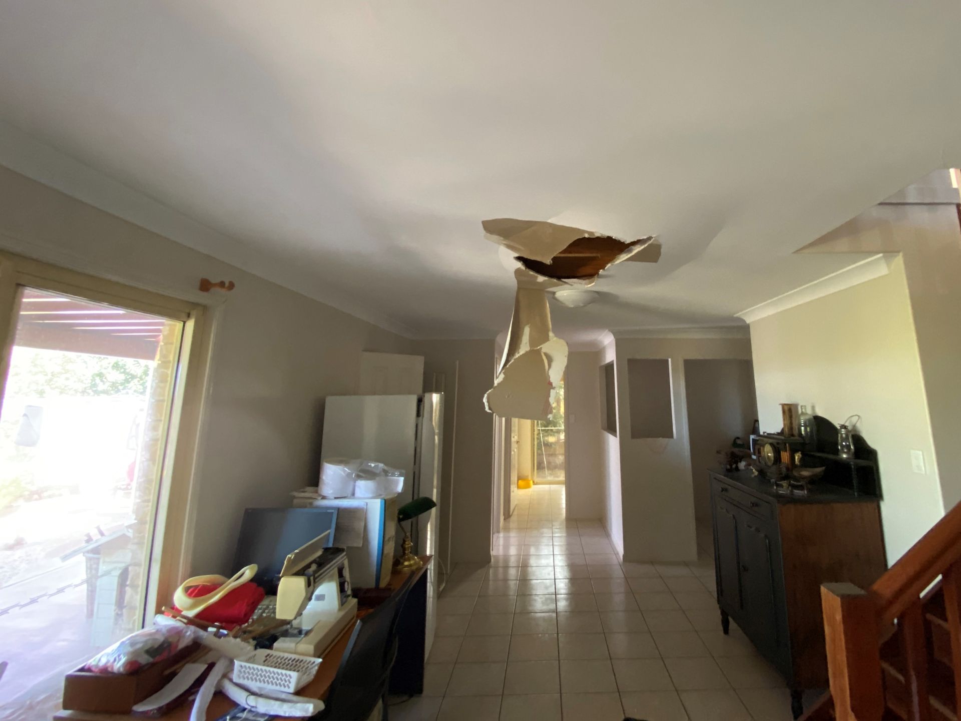 Thermal camera view of footprints on a floor, showing warmer areas in orange and cooler areas in purple.