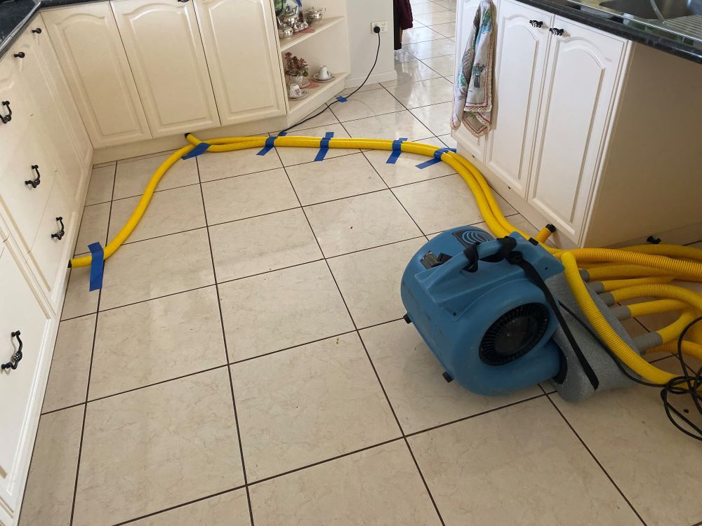 A Kitchen Floor is Being Cleaned — Restore All Qld in Kingaroy, QLD